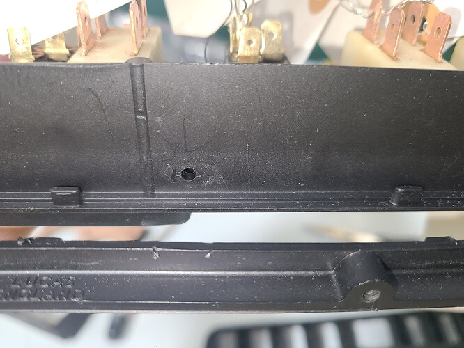 8 - The Bent Tip fits into the hole and then clamps around the right NEW